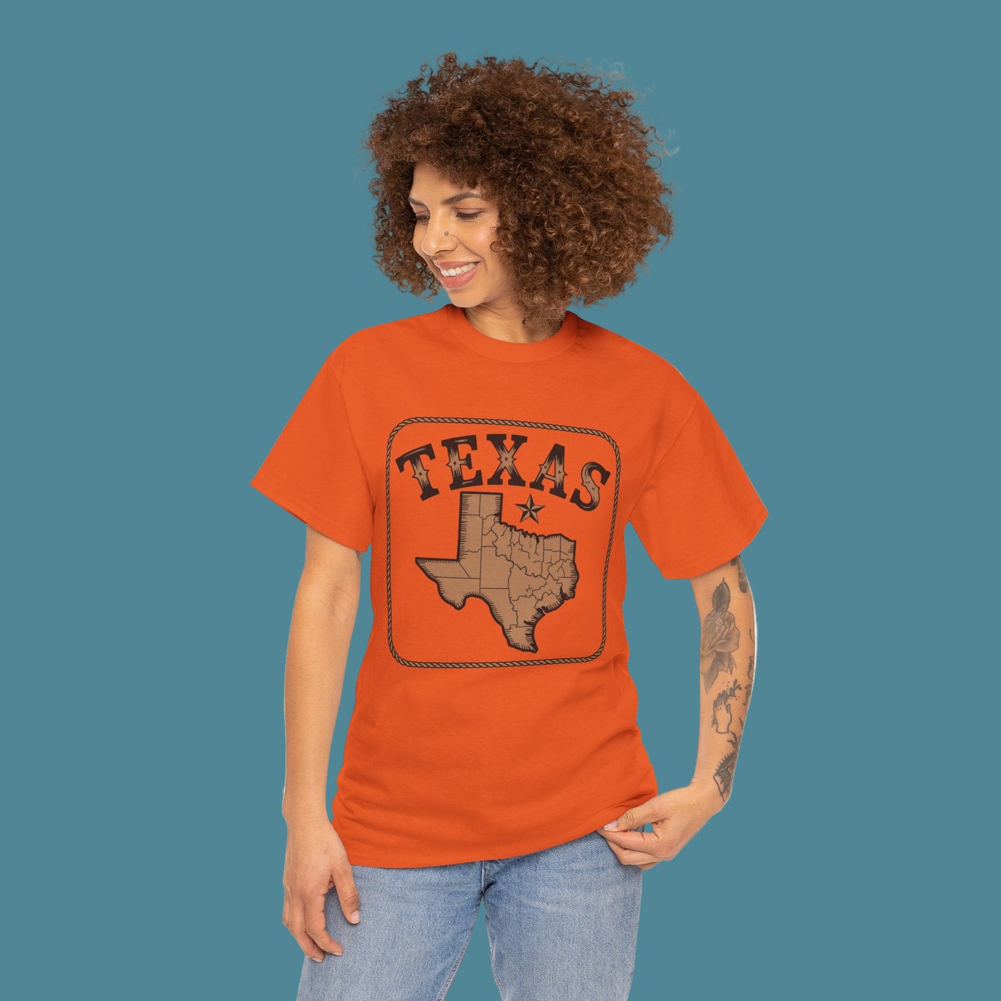 Woman wearing an orange 'Texas' t-shirt with a map design on a white background