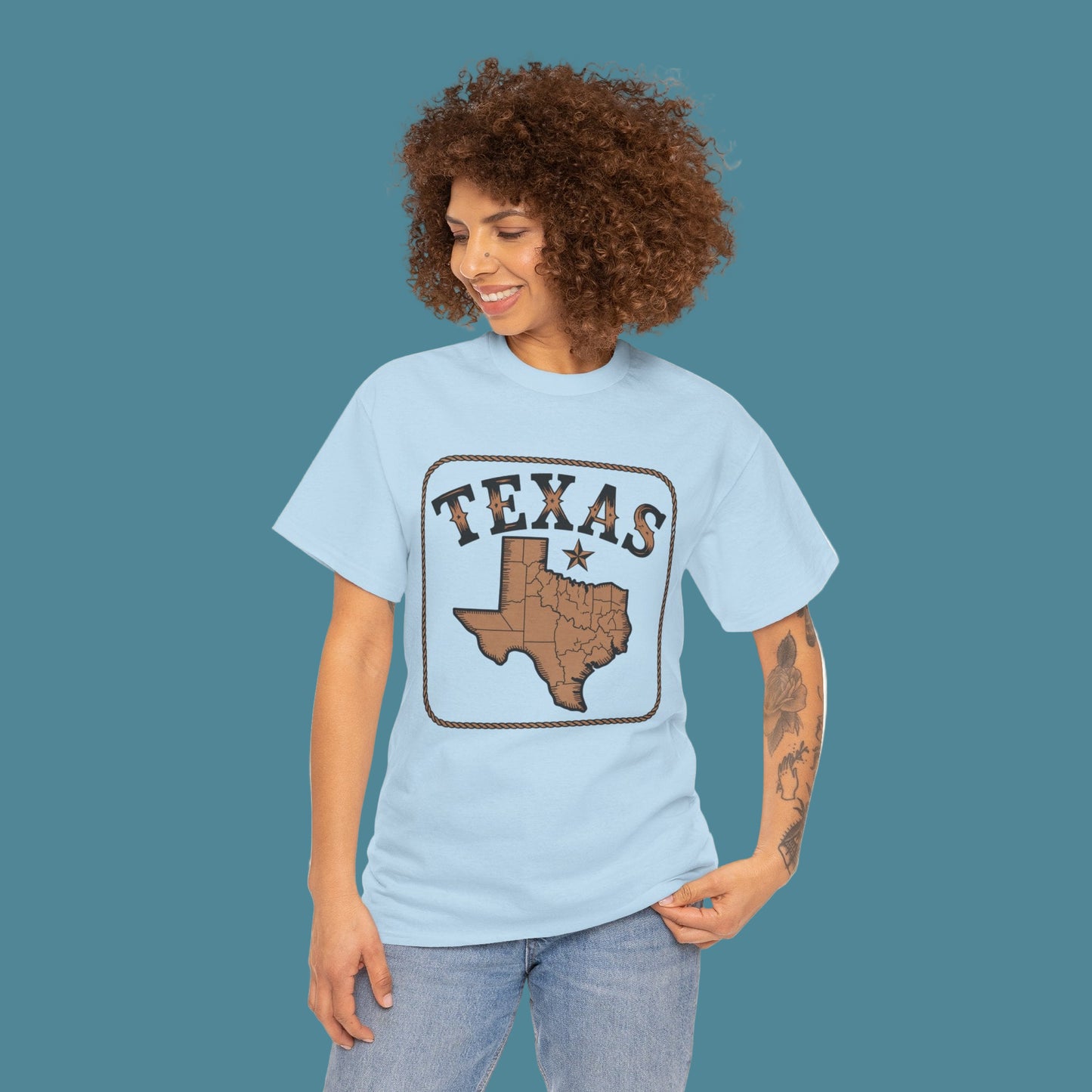 Woman wearing a light blue t-shirt with 'Texas' design on a white background