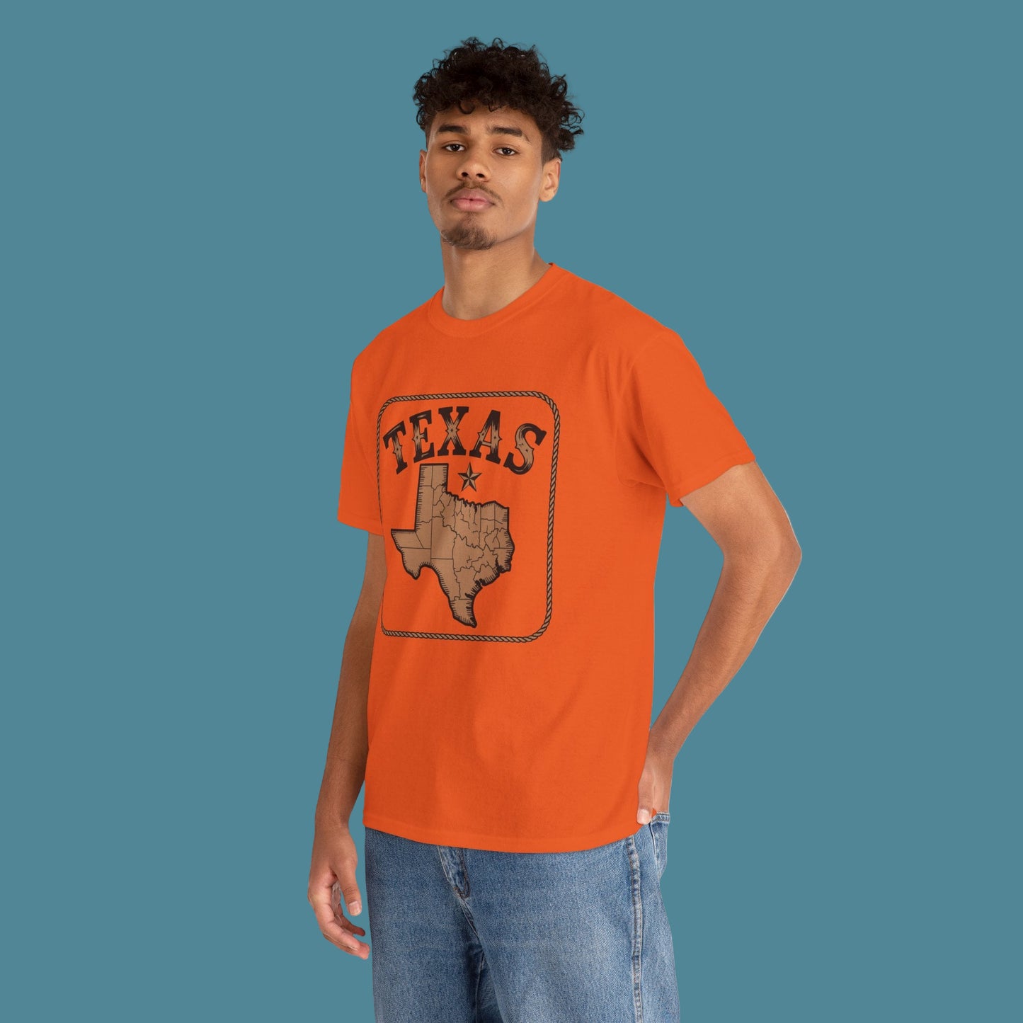 Person wearing an orange t-shirt with 'Texas' design on a white background