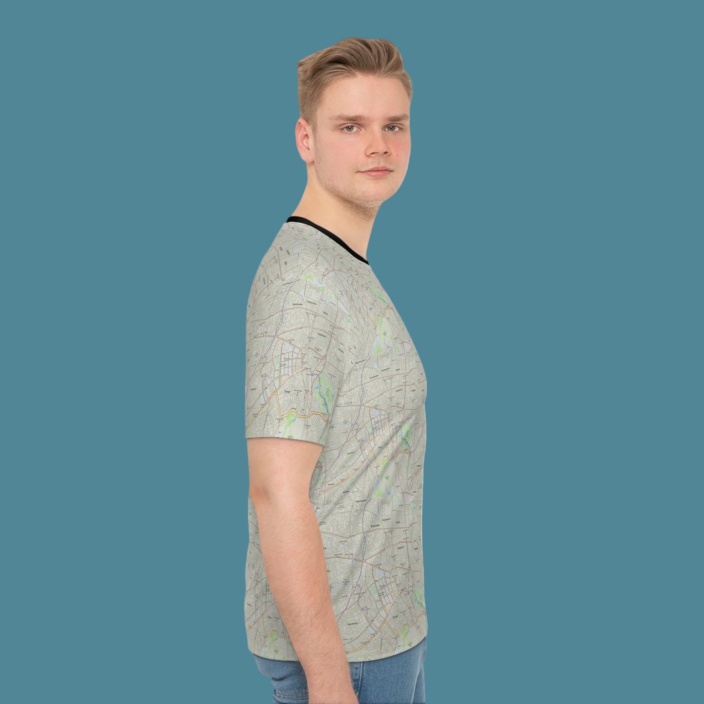 Man wearing a patterned t-shirt on a white background