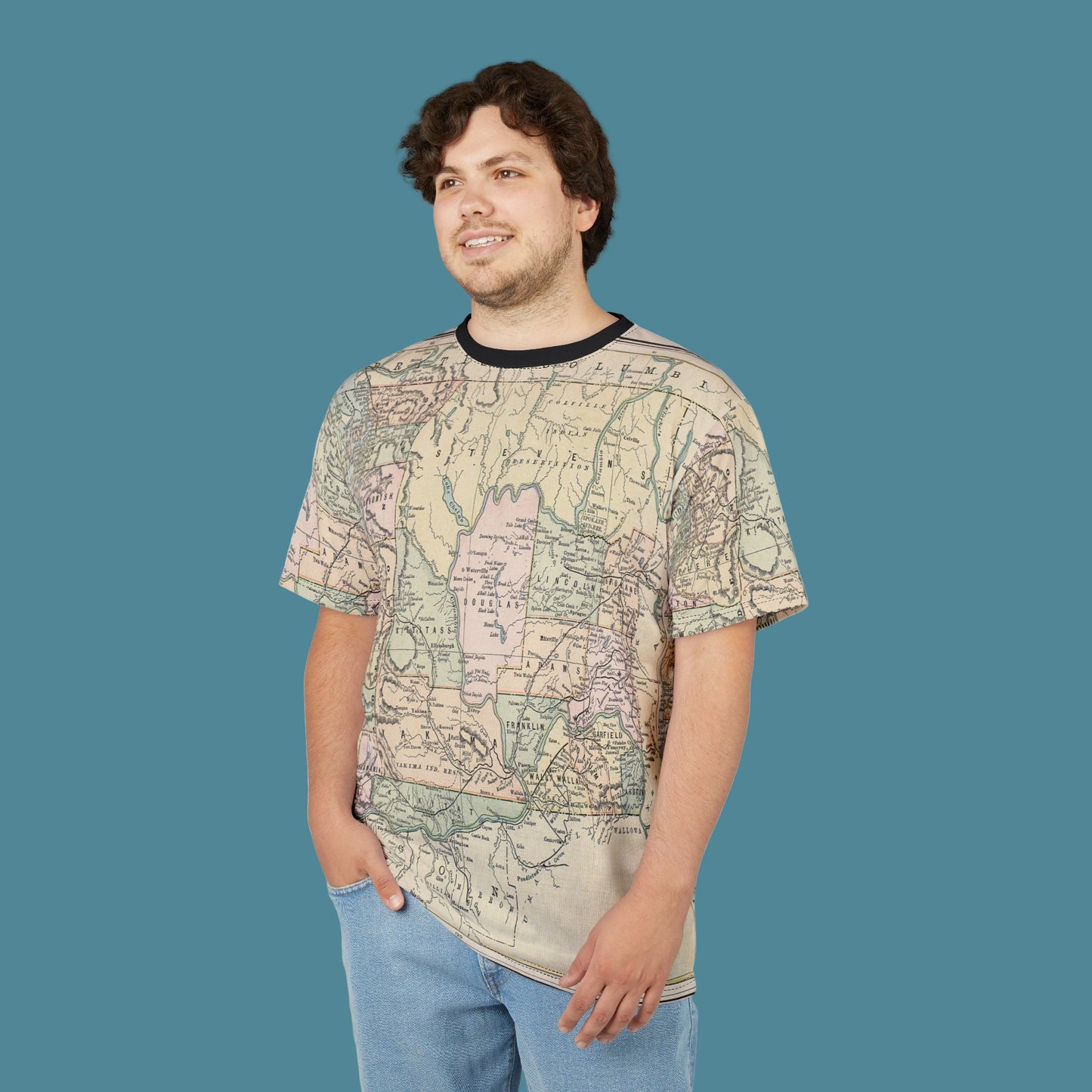 Person wearing a map-patterned t-shirt on a white background