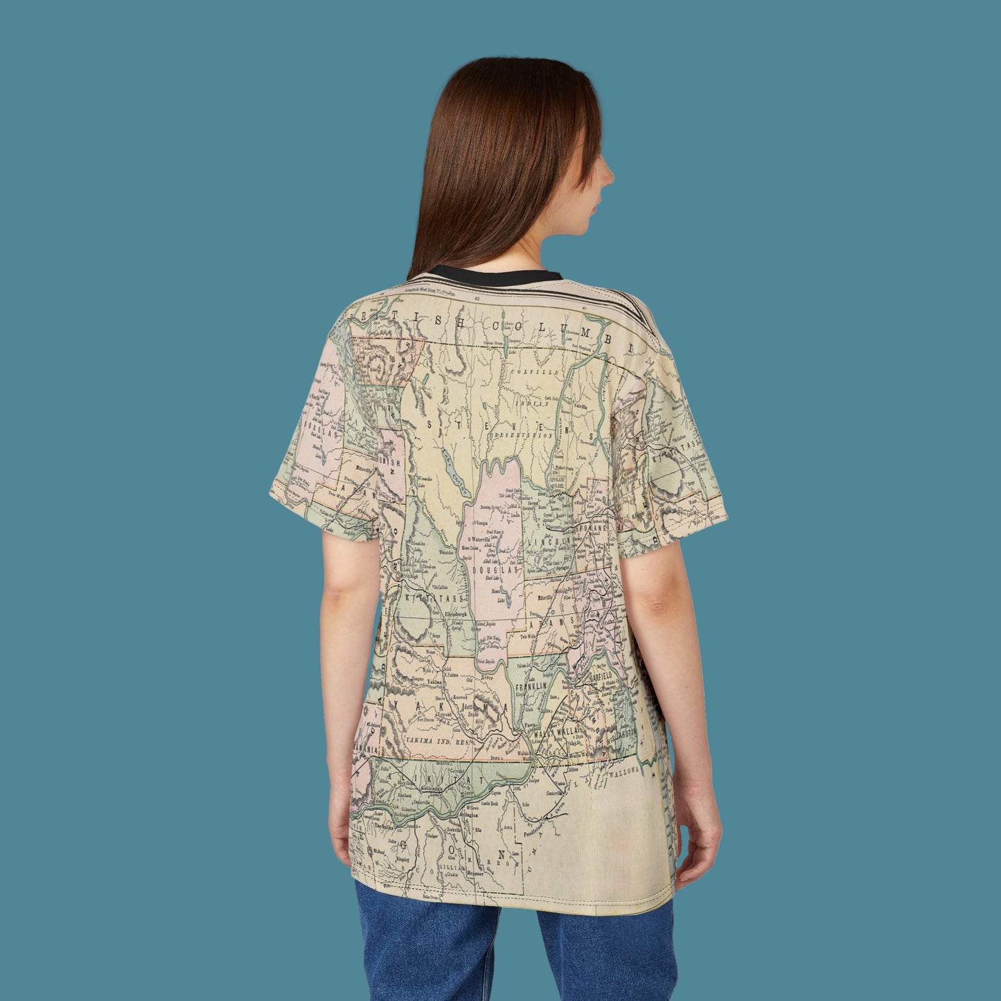 Woman wearing a t-shirt with a map design on a white background