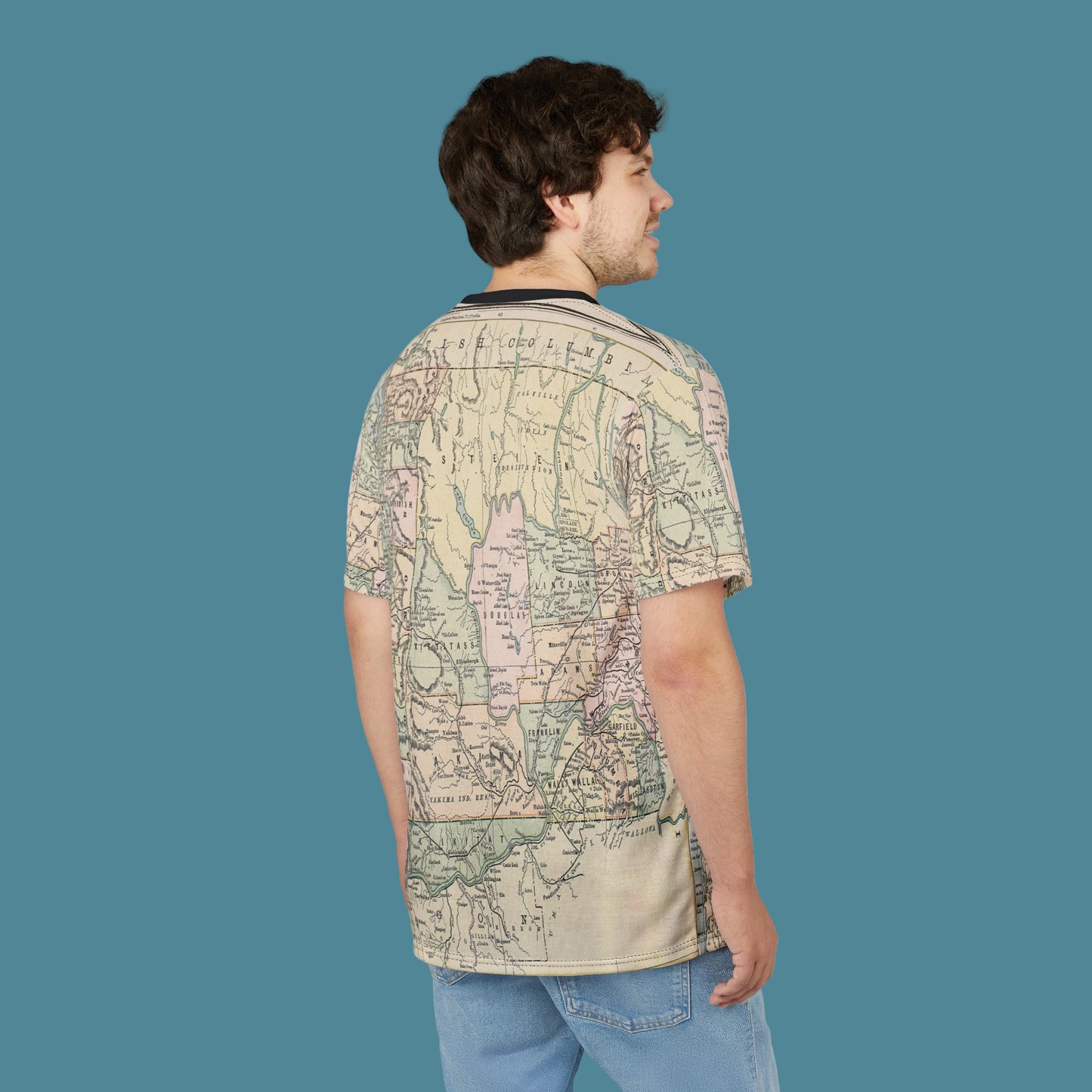 Person wearing a map-patterned shirt on a white background