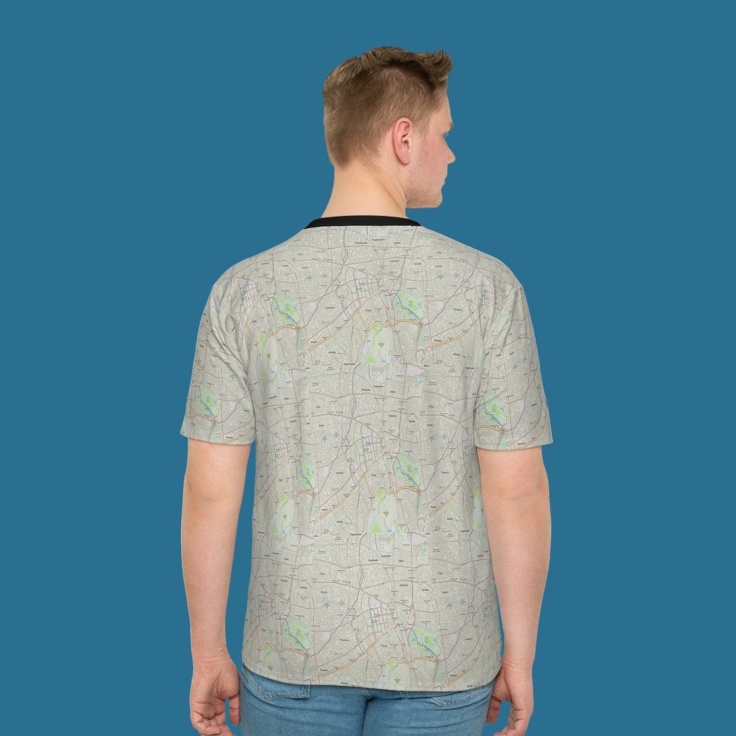 Person wearing a light gray patterned t-shirt on a white background