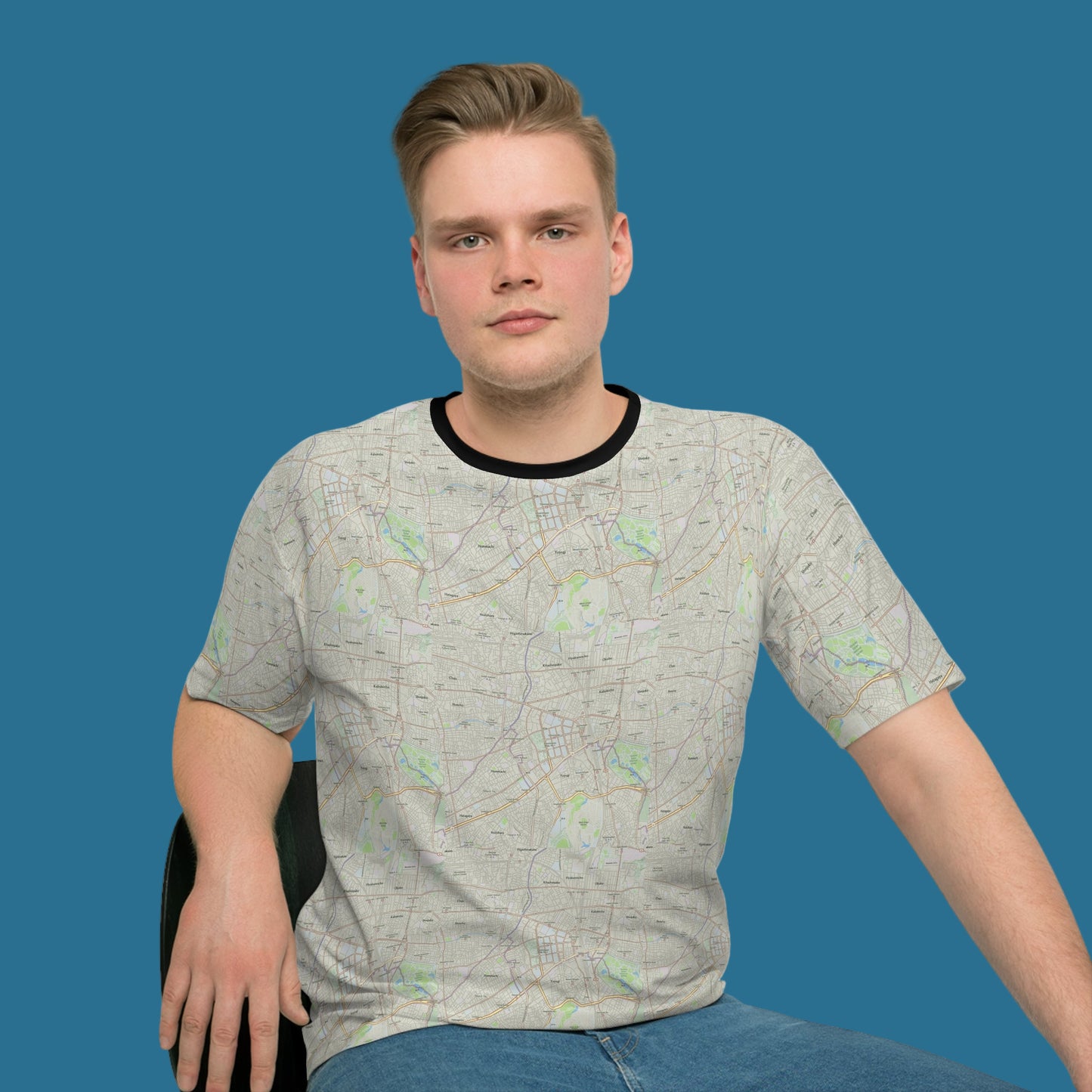 Man wearing a gray t-shirt with a pattern on a white background