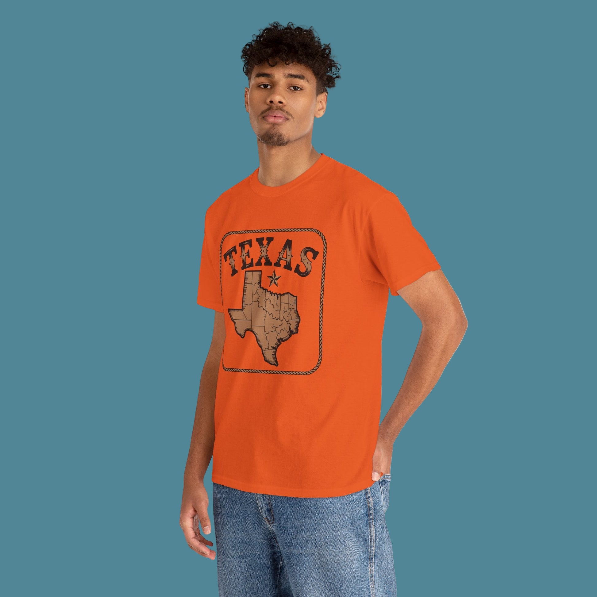 Person wearing an orange t-shirt with 'Texas' design on a white background