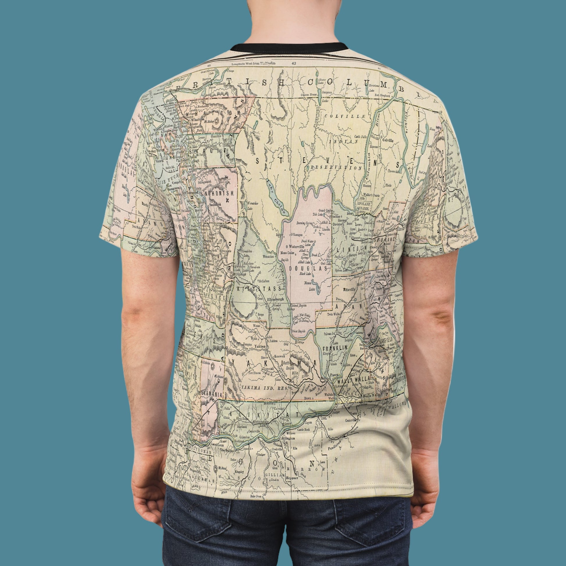 Person wearing a t-shirt with a map design on a white background